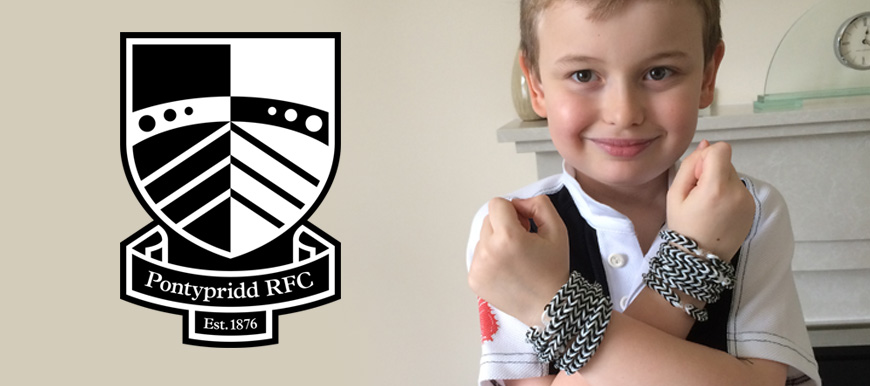Max raises money for “Giving to Pink” with his Pontypridd RFC loom bands.
